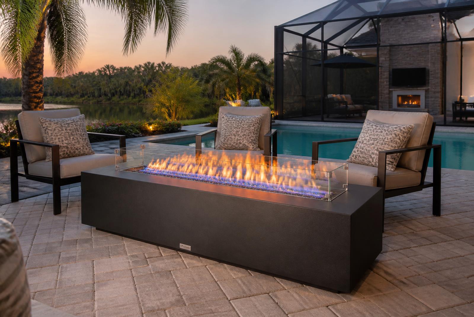 Linear gas fire table on a paver deck at a Largo, FL home