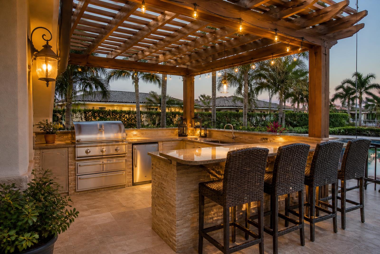 Outdoor kitchen with raised bar seating under a pergola in Seminole, FL