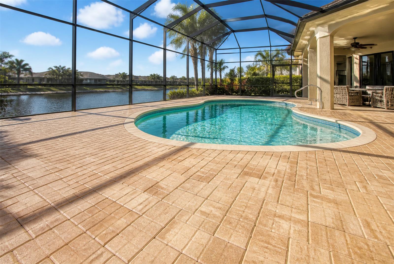 Restored travertine pool deck after cleaning and sealing in Tampa, FL